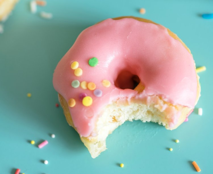 half eaten donut - empty sugar calories