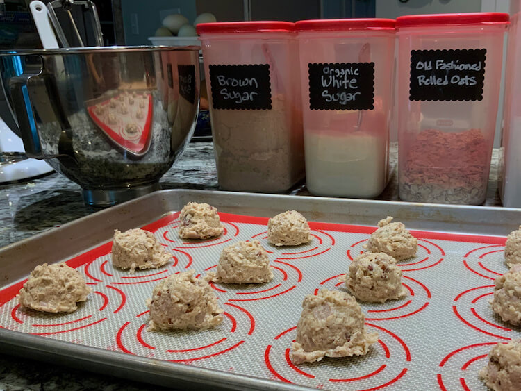 Maple Pecan Oatmeal Cookie Dough portioned on a baking sheet