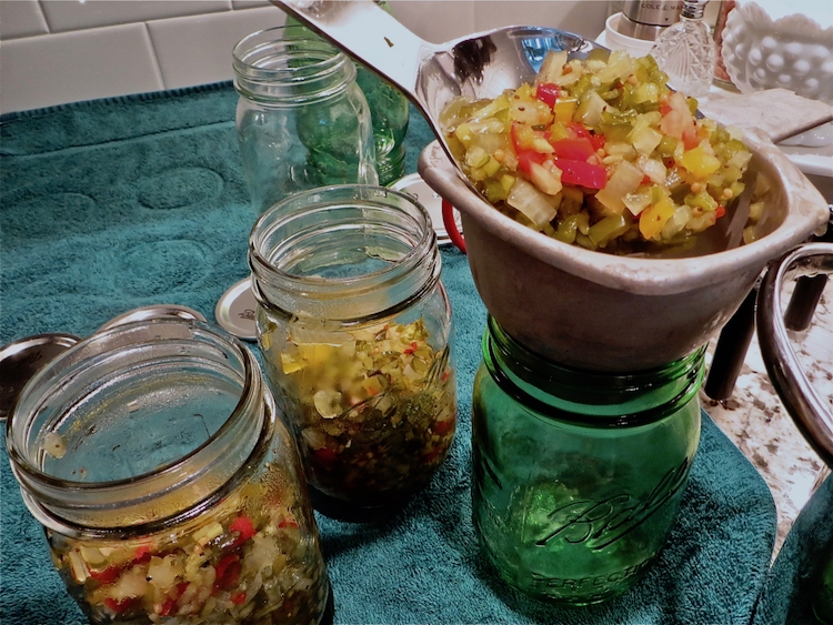 packing homemade relish into jars