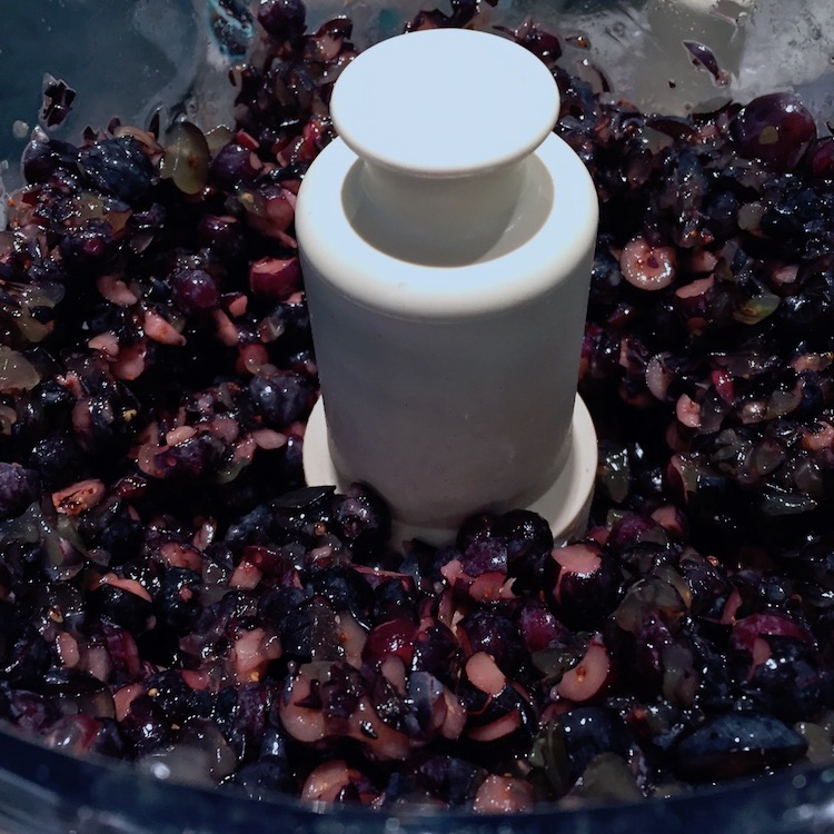 Chopping blueberries and grapes in the food processor