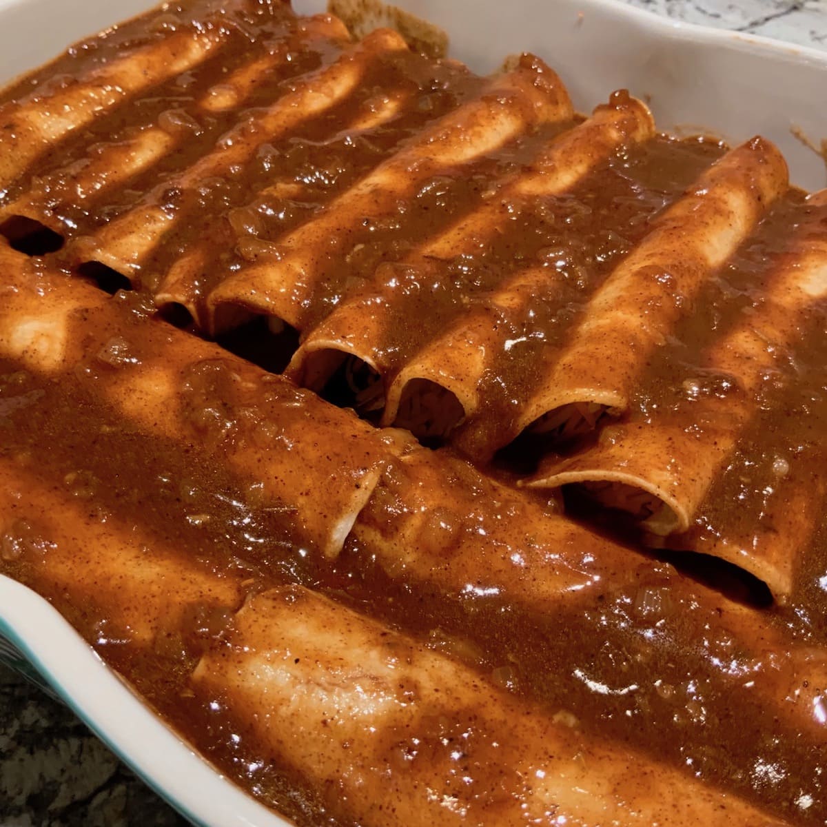 Cheese and Veggie Enchiladas covered in sauce