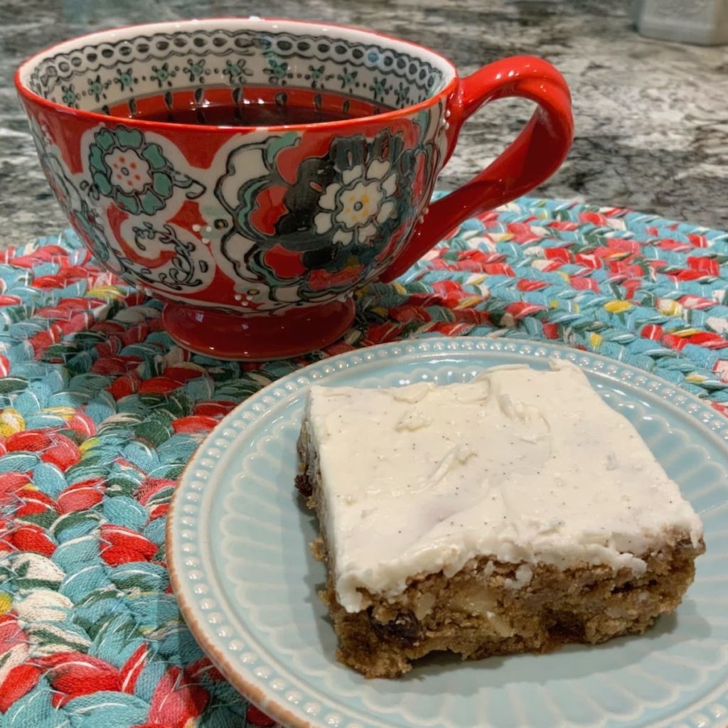 Hermit Bars with Vanilla Icing served with a cup of coffee